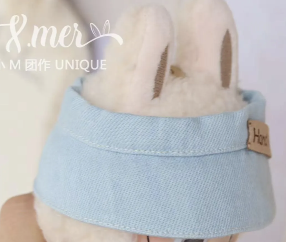 Light blue headband worn by a person with a visible brand logo in the corner.